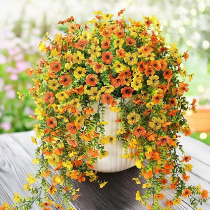 Kaskadenförmig angeordnete Gänseblümchen und Eukalyptusblüten für den Außenbereich – UV-beständig